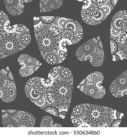 Seamless vector hand drawn pattern with doodle hearts.