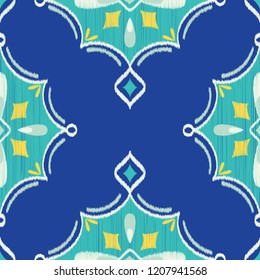 Seamless Vector Ikat Textured Teardrop Diamond Geometric Pattern in Royal, Turquoise, Yellow, and White. Great for apparel, home decor, textiles, stationery, wallpaper, backgrounds, scrapbooking, etc.