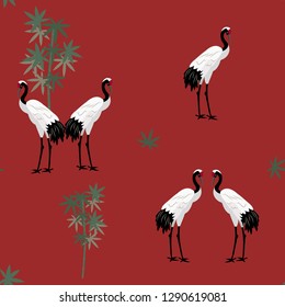 Seamless vector illustration with bamboo and crane birds on a red background. For decorating textiles, packaging, wallpaper.
