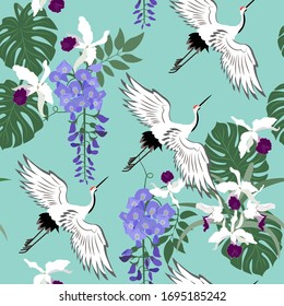 Seamless vector illustration with birds cranes,wisteria and orchid. For decorating textiles, packaging, web design.