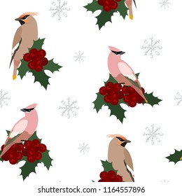 Seamless vector illustration with birds waxwings, holly berries and snowflakes on a white background. For decorating packaging, textiles, covers.
