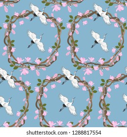 Seamless vector illustration with blooming lilac, magnolia and birds on a blue background. For decorating textiles, packaging, web design.