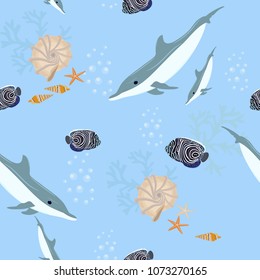 Seamless vector illustration with dolphins and tropical beautiful fish, seashells, seaweed on a blue background. For decorating textiles, packaging and wallpaper.