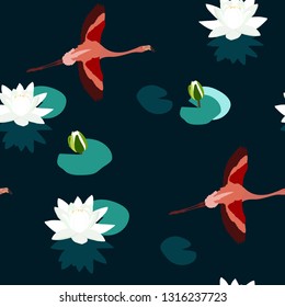 Seamless vector illustration with flamingo and lotuses on a dark background. For decorating textiles, packaging, wallpaper.