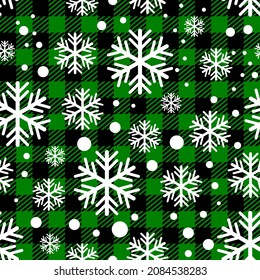 Seamless vector illustration of a green grid with white snowflakes for background or wallpaper.