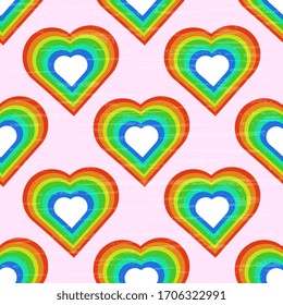 Seamless vector illustration with hearts of rainbow colors on a pinkish background, artistic, textured. Holiday design.