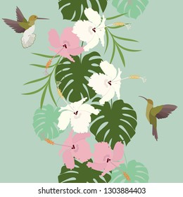 Seamless vector illustration with hibiscus flowers and a birds on a green background. For decorating textiles, packaging, wallpaper.