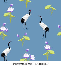 Seamless vector illustration with Japanese cranes and lotuses on a blue background. For decorating textiles, packaging, wallpaper.