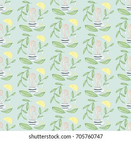 Seamless vector illustration pattern with hand drawn tea cups, tea leaves and lemons