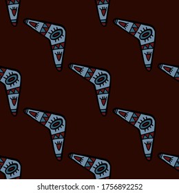 Seamless vector illustration pattern of one way direction colorful tribal style boomerang on natural brown background for making many kinds of printing or textile graphic