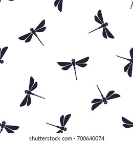 Seamless vector illustration. Pattern with silhouettes of flying dragonfly with a straight body on white background