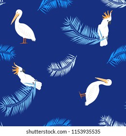 Seamless vector illustration with pelicans, parrots and palm leaves on a dark blue background. For decoration of textiles, packaging and web design.