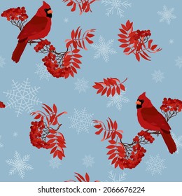 Seamless vector illustration with rowan branches, snowflakes, bird cardinal on a blue background. For decorating textiles, packaging for cosmetics, new year products.