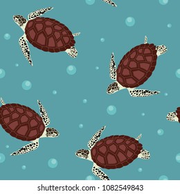 Seamless vector illustration with sea turtles on a blue background. For decorating textiles, packaging and web design.