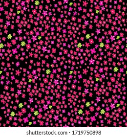 Seamless vector illustration with small pink and red flowers. Ditsy print. Elegant template for fashion prints. Delicate floral pattern on a black background. Use for wrapping, fabric prints, web. 