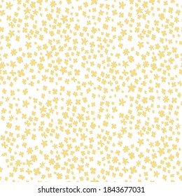 Seamless vector illustration with small yellow flowers. Ditsy print. Elegant template for fashion prints. Delicate floral pattern.