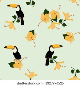 Seamless vector illustration with toucan and hibiscus on a light background. For decorating textiles, packaging, web design.