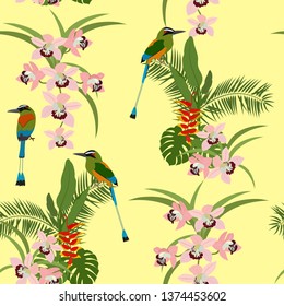 Seamless vector illustration with tropical beautiful flowers and birds on yellow background. For decorating textiles, packaging, web design.