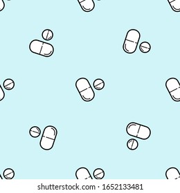 Seamless vector medicine pattern with pills and capsules in line style on blue. Healthcare illustration with repeatable tablet icons. Pharmacy drugstore concept background.