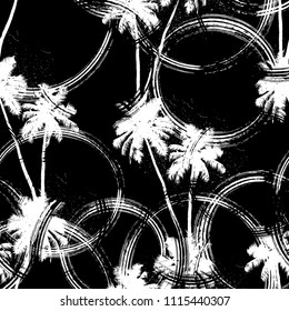 Seamless vector monochrome tropical pattern depicting black palm tree on a white background with dust, streaks and scratches