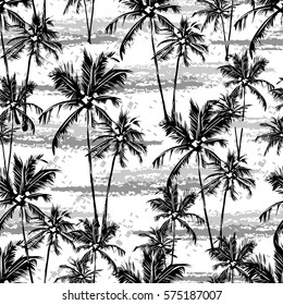 Seamless vector monochrome tropical pattern depicting white palm tree on a black background