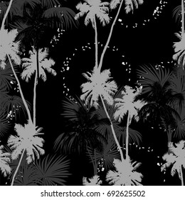 Seamless vector monochrome tropical pattern depicting black palm tree on a white background