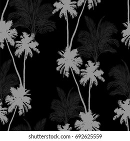 Seamless vector monochrome tropical pattern depicting black palm tree on a white background