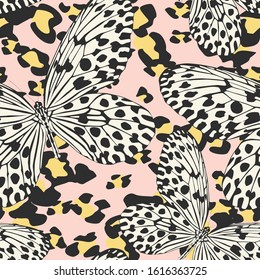 Seamless vector multicolor butterflies pattern. Butterfly on leopard print. Trendy animal motif wallpaper. Fashionable background for fabric, textile, design, banner, cover, web etc.