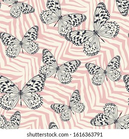 Seamless vector multicolor butterflies pattern. Butterfly on zebra print. Trendy animal motif wallpaper. Fashionable background for fabric, textile, design, banner, cover.