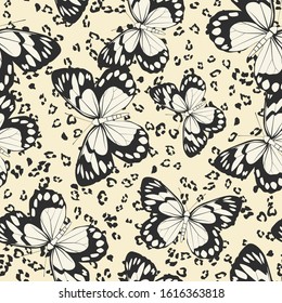 Seamless vector multicolor butterflies pattern. Butterfly on leopard print. Trendy animal motif wallpaper. Fashionable background for fabric, textile, design, banner, cover, web etc.