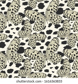 Seamless vector multicolor butterflies pattern. Butterfly on leopard print. Trendy animal motif wallpaper. Fashionable background for fabric, textile, design, banner, cover, web etc.