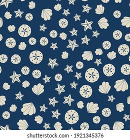 Seamless vector nautical pattern. Ocean themed. Trendy neutral white seashell and starfish shapes on a navy blue background. Perfect for fashion, textile design, home decor, and cute fabric design.