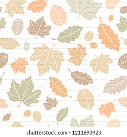 Seamless Vector Pastel Colored Autumn Falling Leaves On Shiplap Wood Plank Background. Great For Holidays, Thanksgiving, Invitations, Stationery, Greeting Cards, Fabric, Paper Crafting, & Home Decor.