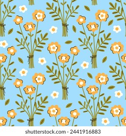 Seamless vector pattern with abstract flowers bouquet. Hand drawn wildflowers on blue background. Country style ditsy texture for wallpaper, wrapping paper, textile, bedding design