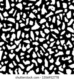 Seamless vector pattern of abstract white pieces, spots, silhouettes. Terrazzo style.