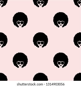 Seamless vector pattern with afro woman face on pink background. Simple flat style.