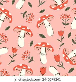 Seamless vector pattern with amanita, red flowers and leaves. Pink background with mushrooms and tulips. Hand drawn cotagecore texture for wallpaper, wrapping paper, textile design