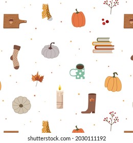 Seamless vector pattern with autumn items: socks, pumpkins, boots, books, leaves, rowan. Suitable for patterns, wallpapers, fabrics, patterns and backgrounds.