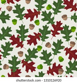 Seamless vector pattern with autumn leaves in seasonal colors. Oak leaf and acorn on white background