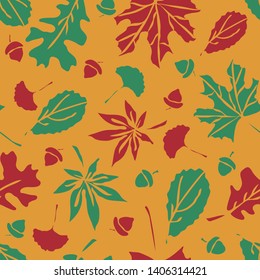 Seamless vector pattern with autumn leaves on mustard yellow background. Beautiful fall wallpaper design. Simple floral Halloween colours.