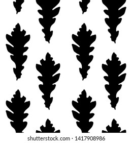 Seamless vector pattern of autumn leaves silhouettes. Black silhouettes of oak leaves on a white background.For decor fabric, paper, packaging, Wallpaper. Black and white graphics.