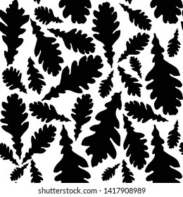 Seamless vector pattern of autumn leaves silhouettes. Black silhouettes of oak leaves on a white background.For decor fabric, paper, packaging, Wallpaper. Black and white graphics.