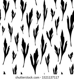 Seamless vector pattern of autumn leaves silhouettes. Black silhouettes of leaves on a white background 