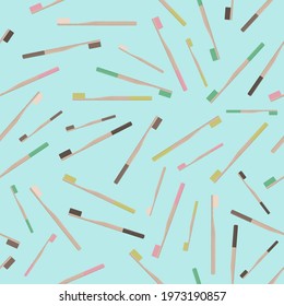 Seamless vector pattern of Bamboo wooden toothbrushes on blue background