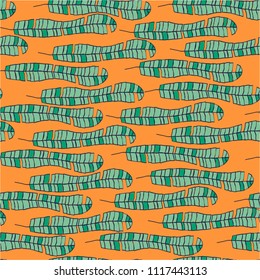 Seamless vector pattern with banana leaves on orange for wrapping, craft, fabric, ceramic, craft