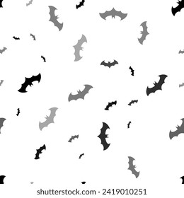 Seamless vector pattern with bat symbols, creating a creative monochrome background with rotated elements. Vector illustration on white background