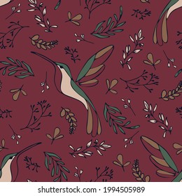 Seamless vector pattern with beautiful hummingbird on dark red background. Simple tropical bird wallpaper design. Decorative vintage fashion textile.