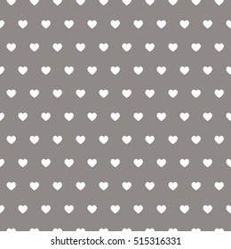 Seamless vector pattern with beige hearts on pastel background