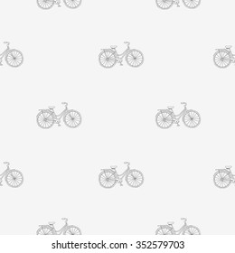 Seamless vector pattern of the bike on a light gray background.