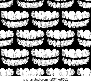 Seamless vector pattern of black and white hand drawn angry teeth on black background.